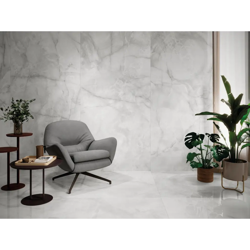 Grijze draaistoel met zwarte metalen poten en comfortabele zitting, geïnspireerd door Vitra, perfect voor Onix Wit Mat 60x120 Rett