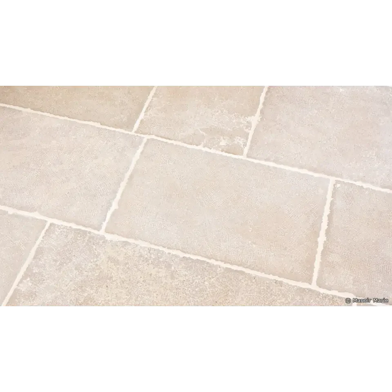 Beige stone tile flooring with grout lines from Ambachtelijke Firenze Beige