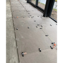 Tile leveling system with spacers and clips on Ambiente Nut Mat 90 x 90 Rett vloer