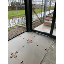 Tile spacers on concrete floor with Ambiente Nut Mat 90 x 90 Rett