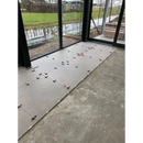 Tile spacers on concrete with Ambiente Nut Mat 90 x 90 Rett in the background