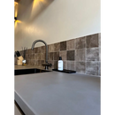 Curved stainless steel kitchen faucet with Assisi Truffle wandtegel tiles backdrop