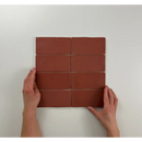 Acht roestbruine rechthoekige tegels in een grid, Atlas Garnet Mate 7,5x15