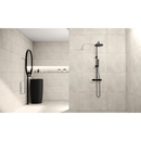 Modern black pedestal sink with matte black faucet in Beton Cire Bercy Nude 60x120