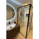Modern bathroom featuring Colonial Ivory glans tiles, backlit mirror, and vessel sink