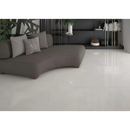 Curved gray modern sofa with pillows, perfect for the Crystal Ivory 60x60 style