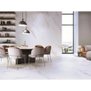 Moderne ronde eettafel met upholstered stoelen en pendant lights boven Diamond Gold mat 120x280