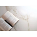 Open book with a pen on Diamond Gold mat 60x60 rett, perfect for elegant note-taking