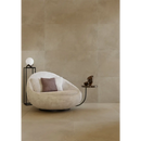 Curved cream lounge chair with brown pillow, perfect for Hollstone Sour 60x60 style