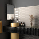 Gouden cilindervaas op een zwart geribbeld plankje met Kalma Morchella 6x18 mat