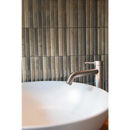 A modern chrome faucet with minimalist design on a white ceramic sink in kit kat musgo glossy 11,5x23,1 style
