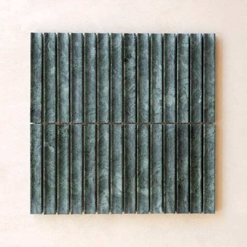 Dark green vertically ribbed mosaic tile panel with textured stone finish in lulu indian green kitkat style