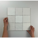 Negen witte vierkanten in een 3x3 grid van Moos White glans handvorm 13x13