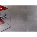 Red chair with curved metal frame beside Nexus Pearl anti-slip R11 60x60 tile