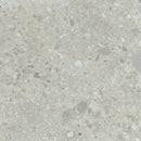 Speckled grey terrazzo surface of Nover Steel 80x80 rett with unique aggregate