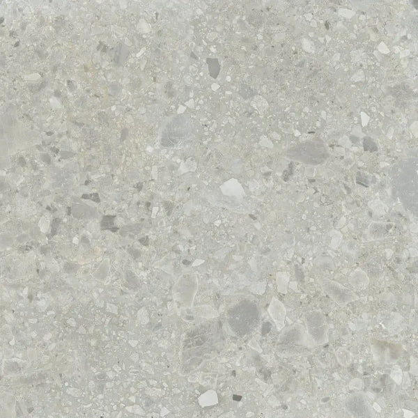 Speckled grey terrazzo surface of Nover Steel 80x80 rett with unique aggregate