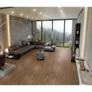 Grijze L-vormige bank met kussens naast Padouk Nut 30x160 plank