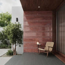 Woven rope chair with wooden frame against a brick wall, perfect for Potters serie