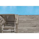 Woven lounge chair op houten terras met Terrastegel Padouk Grey 30x120