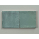 Twee matte teal keramische trend tegels licht met licht blauw glans 10x10 en iets ongelijke randen naast elkaar