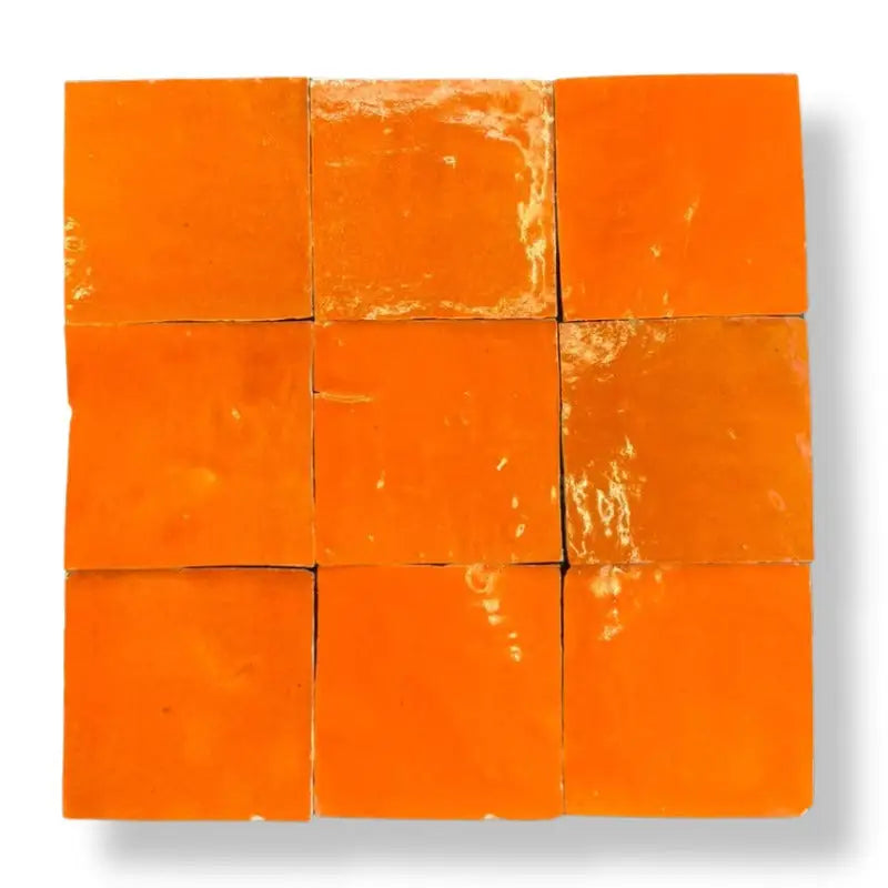 Vibrante oranje zellige alcazar tegels 10x10 cm met licht glanzende textuur in een 3x3 grid geplaatst