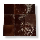 Donkere bruine zellige tegels chocolat 10x10 met glossy, textuur en subtiele witte aders geschikt als vloertegels