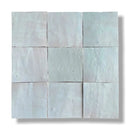 Negen pale blauw-groene Zelliges Alhambra tegels in een vierkant patroon