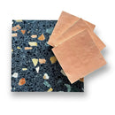 Stukken roze chocolade op een donkere ondergrond met Zelliges Alhambra Salmon 10x10